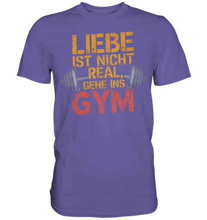 T-Shirt mit Hantel-Motiv und Spruch: 'Liebe ist nicht real, gehe ins Gym' - Premium Shirt